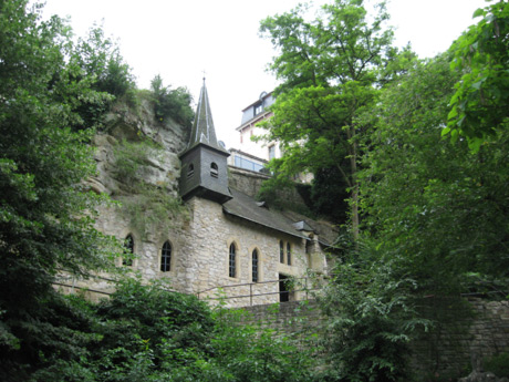 Small castle surrounded by green vegetation luxembourg grund photo